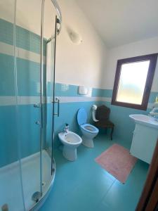 a bathroom with a shower and a toilet and a sink at Stazzo Galeone in Casagliana