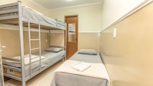 Postel nebo postele na pokoji v ubytování Pousada F7