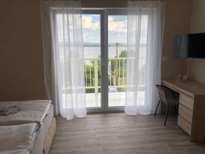 Postel nebo postele na pokoji v ubytování Holiday Centrum