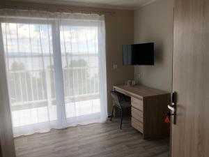 TV a/nebo společenská místnost v ubytování Holiday Centrum + 37 fotografií