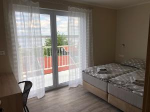 Postel nebo postele na pokoji v ubytování Holiday Centrum