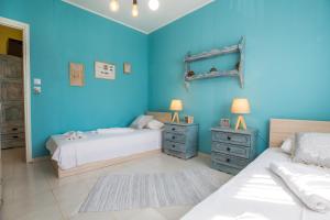 Olive Cottage tesisinde bir odada yatak veya yataklar