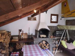 a room with a stone oven with a bed in it at Privát Zvonček in Terchová