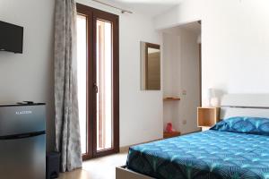 Postel nebo postele na pokoji v ubytování Acquachiara Rooms