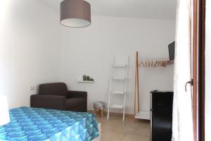 Postel nebo postele na pokoji v ubytování Acquachiara Rooms