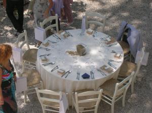 a white table with chairs and a table with plates and silverware at FonteAntica Agriturismo in Norcia