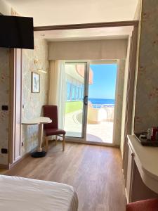 Postel nebo postele na pokoji v ubytování Hotel Flamingo