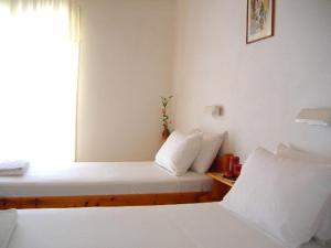 A bed or beds in a room at Rantos Apartments