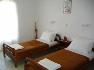 A bed or beds in a room at Rantos Apartments