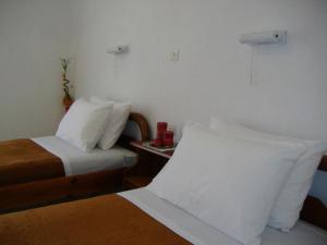 A bed or beds in a room at Rantos Apartments