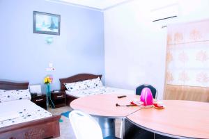 Postel nebo postele na pokoji v ubytování Nora Hotel