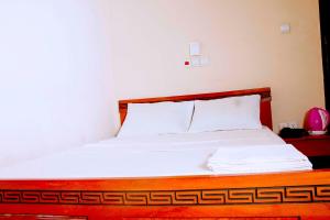 Postel nebo postele na pokoji v ubytování Nora Hotel