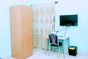 TV a/nebo společenská místnost v ubytování Nora Hotel