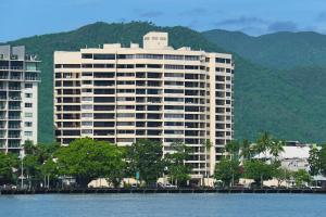a large building next to a body of water at Cairns Aquarius in Cairns