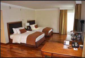 Postel nebo postele na pokoji v ubytování Hotel Intercontinental Cali by IHG