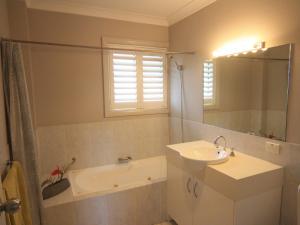 A bathroom at 339 Pacific Blue 265 Sandy Pt Road HUGE RESORT LAGOON POOL