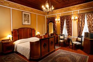 En eller flere senge i et værelse på Hotel Residence Hebros