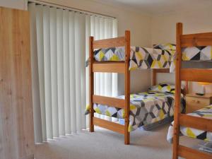 A bunk bed or bunk beds in a room at The Verandah', 9 Hanson Avenue - fantastic child friendly home