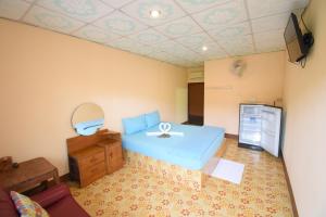 Giường trong phòng chung tại Mukda Guesthouse