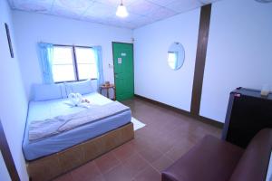 Postel nebo postele na pokoji v ubytování Mukda Guesthouse
