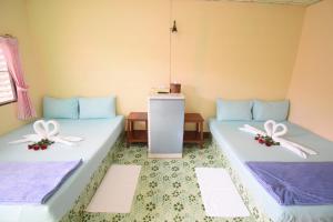 Postel nebo postele na pokoji v ubytování Mukda Guesthouse