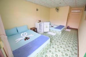 Postel nebo postele na pokoji v ubytování Mukda Guesthouse