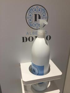 a bottle of milk sitting on a shelf in a refrigerator at Albergo Dongo in Dongo