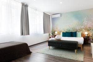 Postel nebo postele na pokoji v ubytování Francis Superior Rooms
