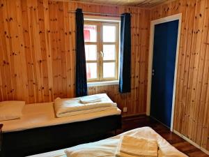 Ліжко або ліжка в номері Statles Rorbu- og Konferansesenter AS