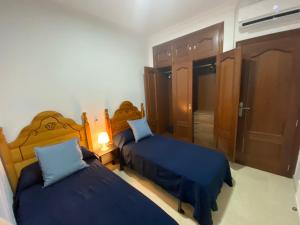 Postel nebo postele na pokoji v ubytování SWEET HOME AYAMONTE