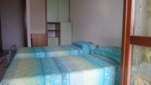 Postel nebo postele na pokoji v ubytování B&B La Posada Stintino