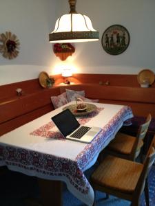 a table with a laptop sitting on top of it at Apartment in Seefeld in Tirol in Seefeld in Tirol