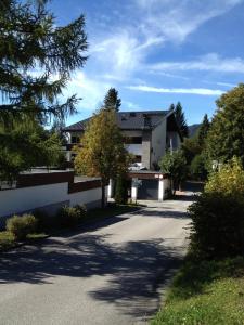 a house on a street with a driveway at Apartment in Seefeld in Tirol in Seefeld in Tirol