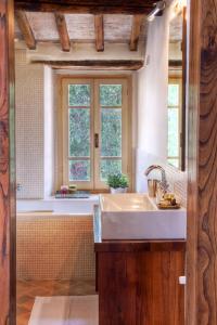 a kitchen with a sink and a window at Borgo Della Marmotta in Spoleto