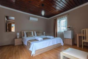 Postel nebo postele na pokoji v ubytování Royal House