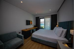 Postel nebo postele na pokoji v ubytování El Primero Hotel