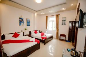 Letto o letti in una camera di Conico Đà Lạt Hotel