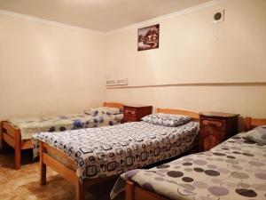 a room with two beds in a room at Hostel Sakharov & Tours in Yerevan