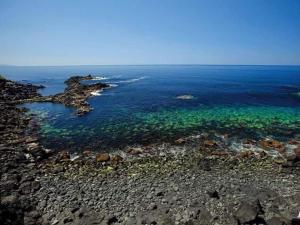 an aerial view of the ocean with rocks and water at Cantinho do Sonho in Maia