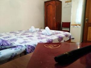 a room with a bed and a table and a table sidx sidx sidx at Hostel Sakharov & Tours in Yerevan