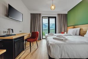 Ένα ή περισσότερα κρεβάτια σε δωμάτιο στο Intourist Kazbegi