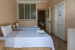 Postel nebo postele na pokoji v ubytování Royal House