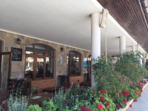 a restaurant with flowers and plants in a building at Hotel Royal Dreams Beach only 5min in Sunny Beach