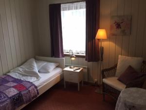 Postel nebo postele na pokoji v ubytování Eikum Hotel