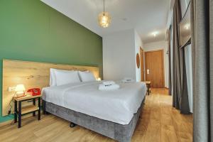 Ένα ή περισσότερα κρεβάτια σε δωμάτιο στο Intourist Kazbegi