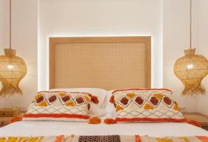 Postel nebo postele na pokoji v ubytování Blue Jasmine Apartments