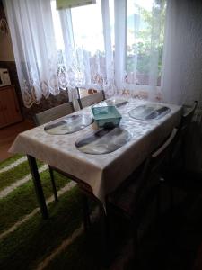 a table with a white table cloth on top of it at Ubytovanie u Vlasty in Štrba