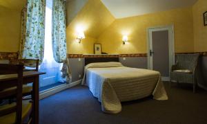 Postel nebo postele na pokoji v ubytování Le Chalet Montégut