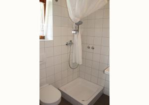 a bathroom with a toilet and a sink at Sporerhof in Murnau am Staffelsee