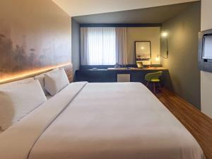 Cama ou camas em um quarto em Hotel Cassino Tower Curitiba Aeroporto By Nacional Inn